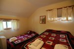 One full and one twin bed in second bedroom of vacation condo